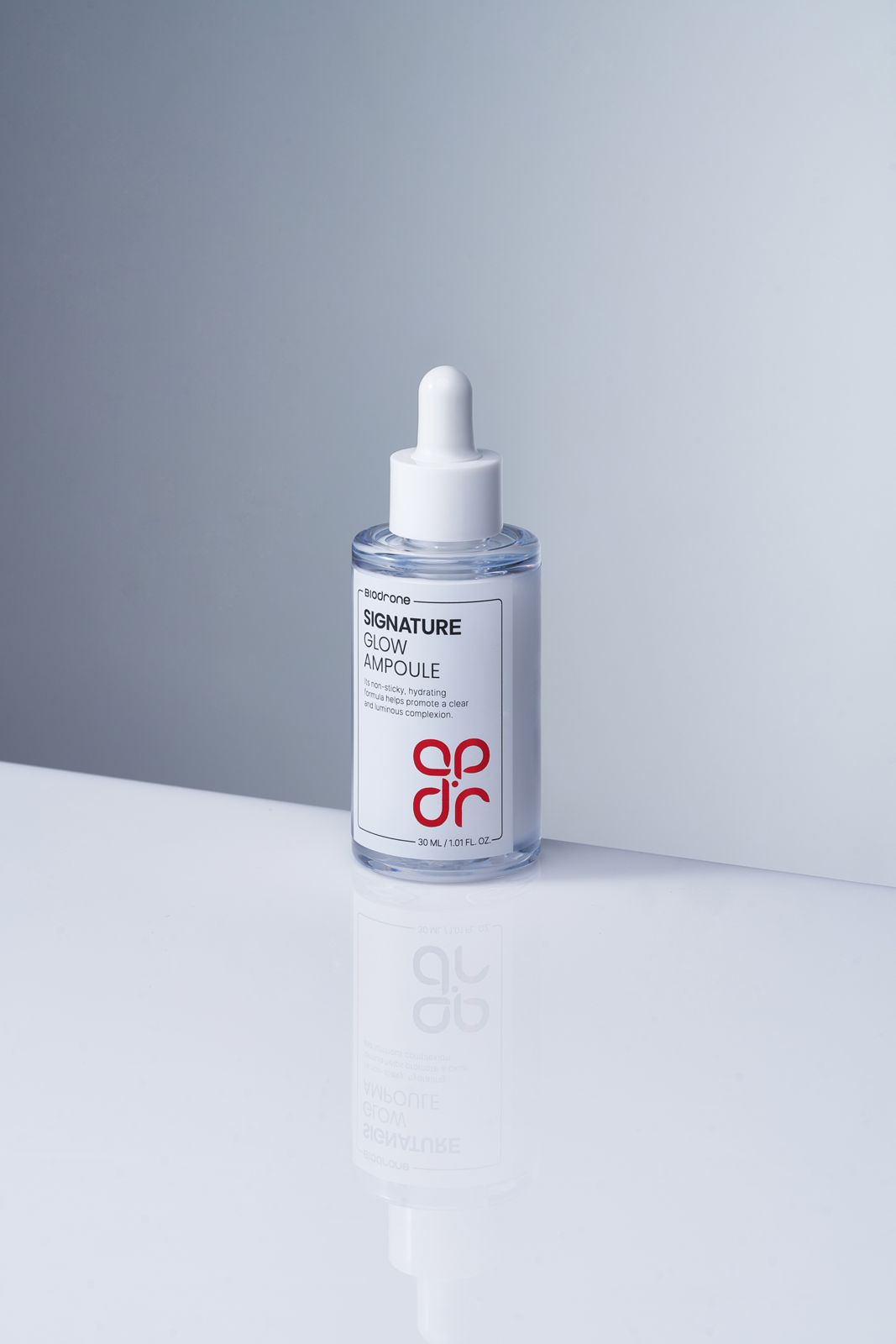 BIODRONE · 스킨케어 제품촬영 — 정면 단독 병컷, 화이트 바닥 위 반사 효과