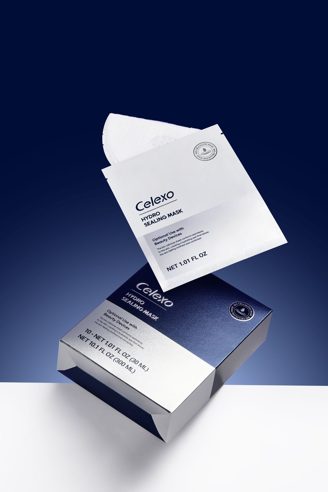 Celexo · 엑소테라피 스킨케어 — 마스크 시트와 패키지 박스를 함께 띄운 기본 제품컷, 블루 배경