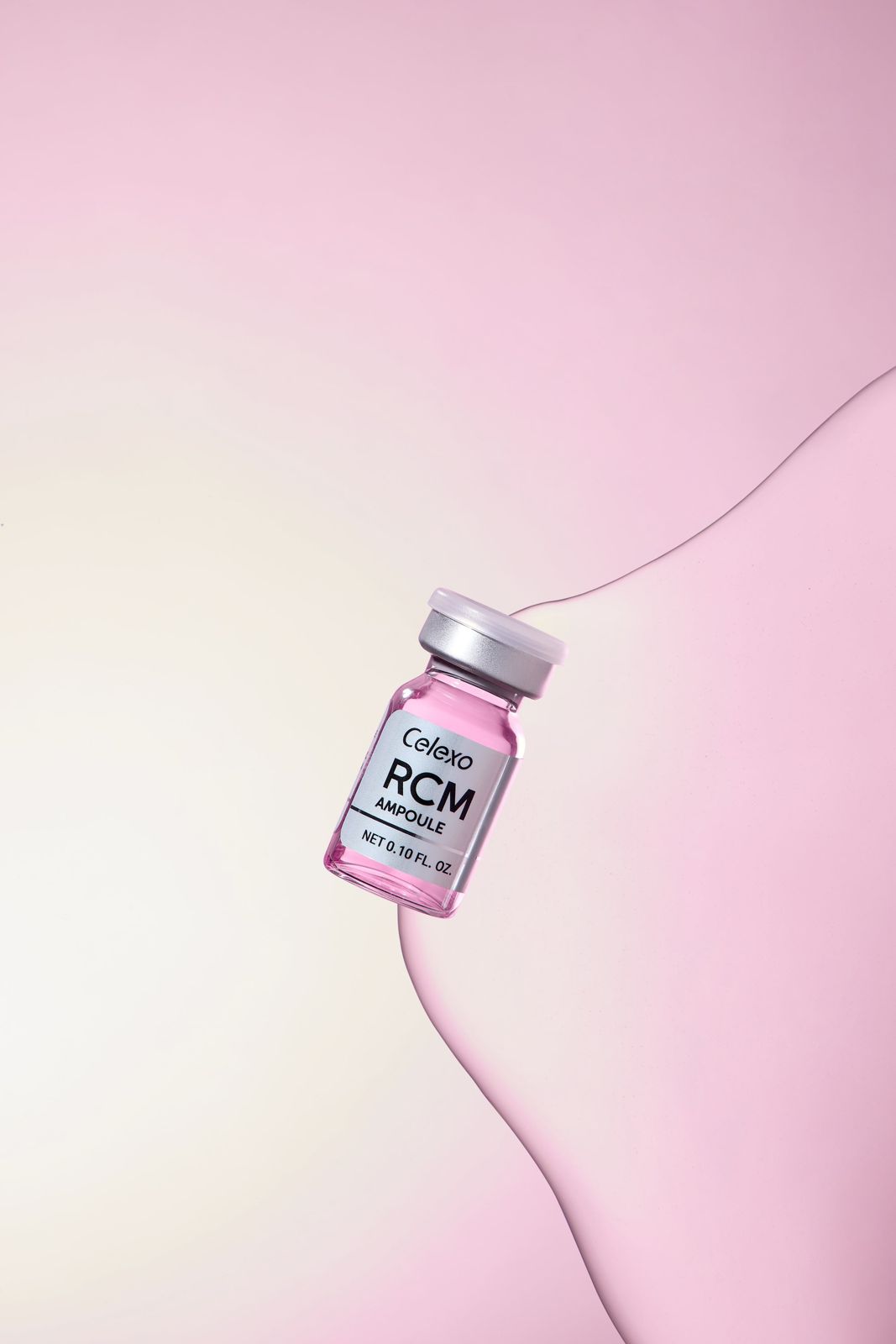 Celexo · RCM 앰플 — 물결치는 핑크 리본 형태의 그래픽 배경 위에 제품을 배치한 연출컷