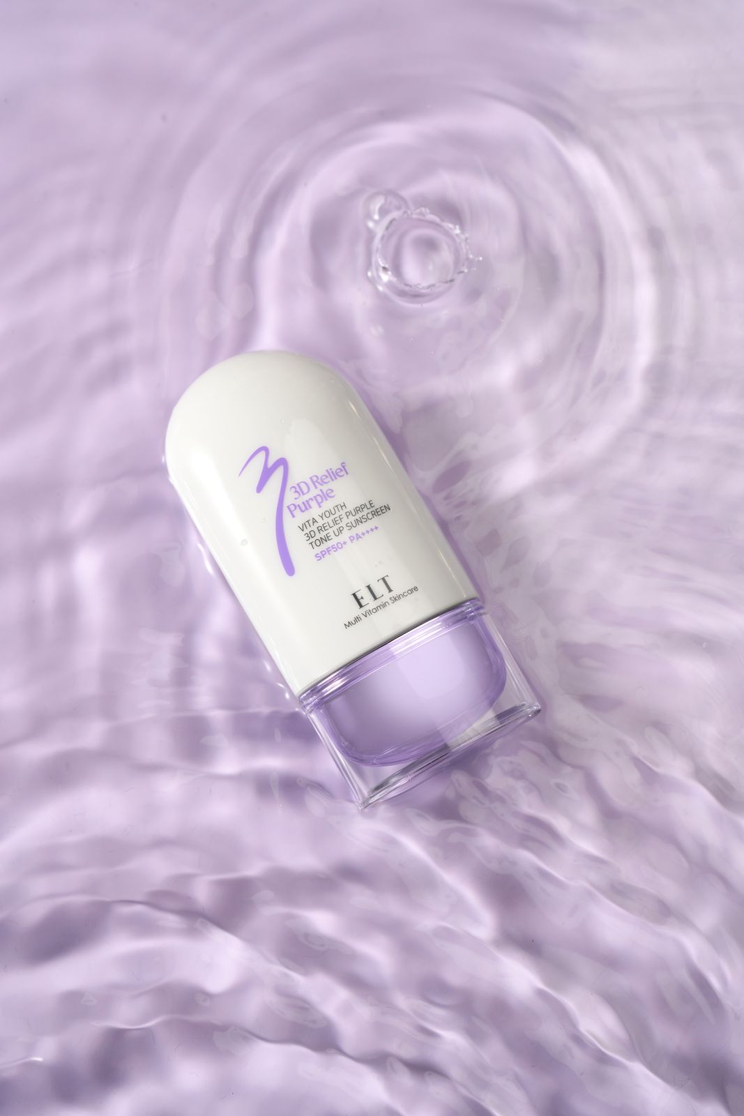 ELT COSMETIC · 선스크린 — 탑뷰 구도, 물결이 이는 수면 위에 놓인 제품 연출컷