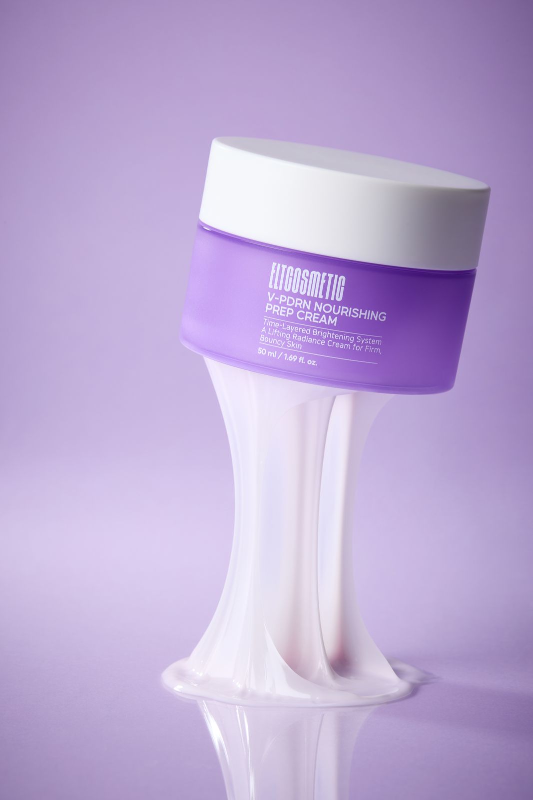 ELT COSMETIC · V-PDRN 크림 — 퍼플 그라데이션 배경, 제형 위에 떠 있는 듯한 용기 연출컷