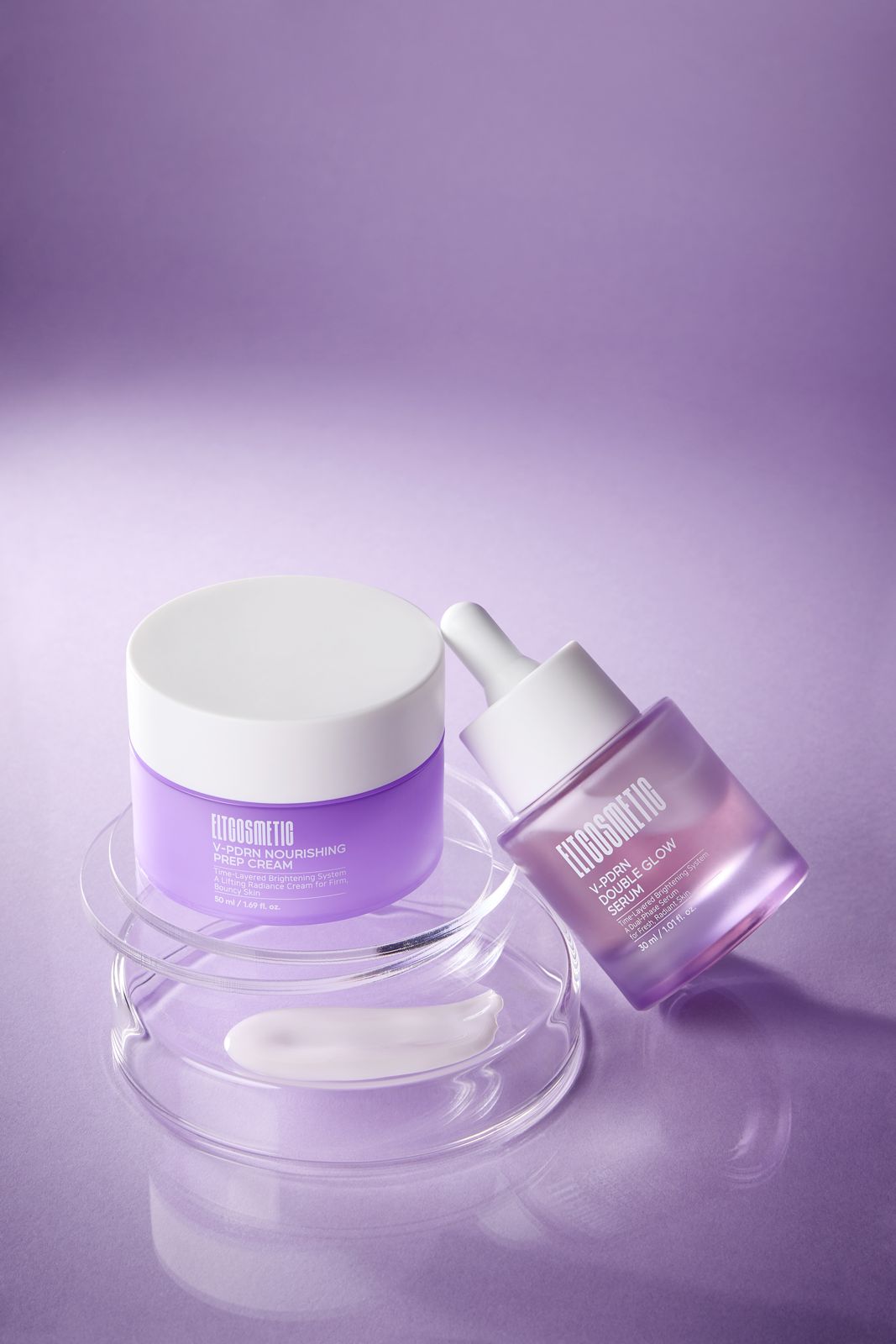 ELT COSMETIC · V-PDRN 크림 — 퍼플 배경, 유리 샬레 위 크림과 세럼(다른 라인) 병을 함께 놓은 그룹컷