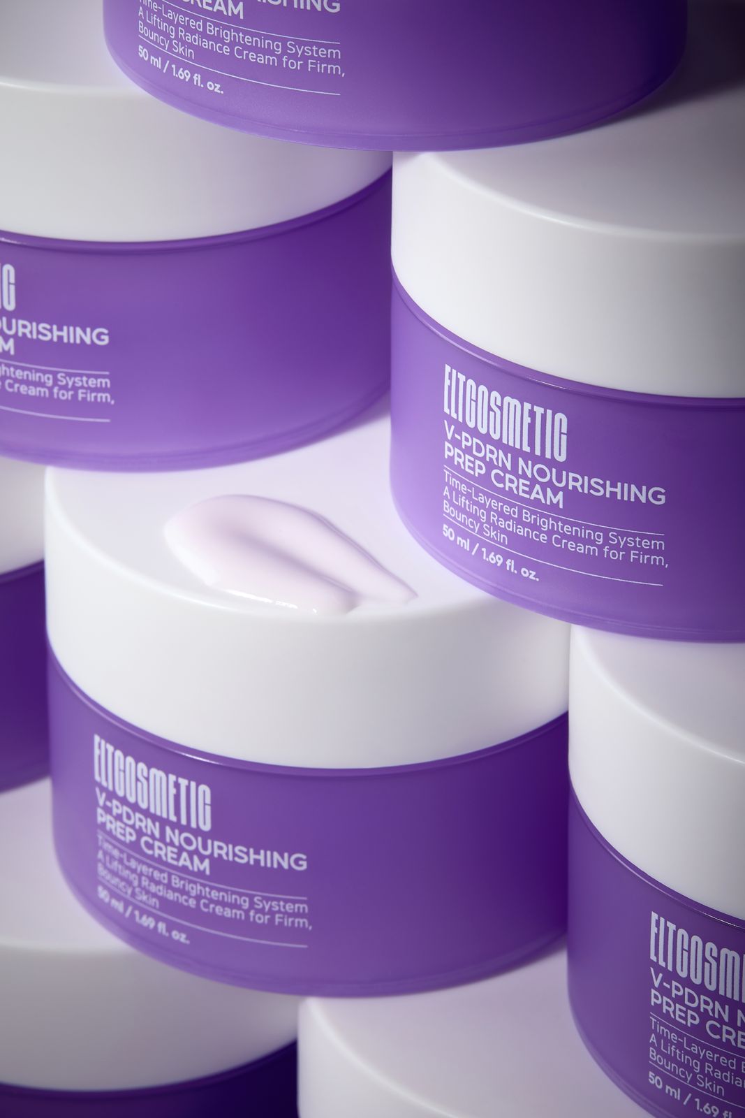 ELT COSMETIC · V-PDRN 크림 — 용기 여러 개를 쌓은 그룹컷, 뚜껑 위에 제형 스와치를 올린 다른 각도