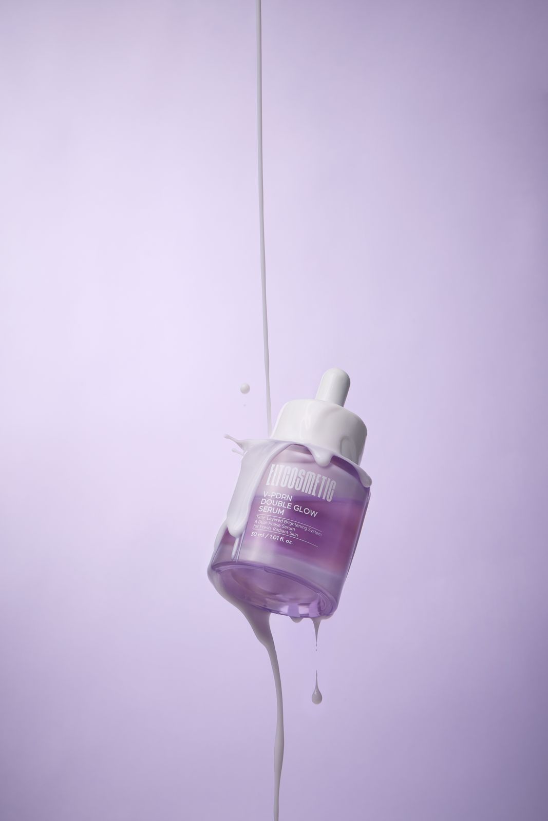 ELT COSMETIC · V-PDRN 세럼 — 병이 허공에 떠 있고 제형이 흘러내리는 연출컷