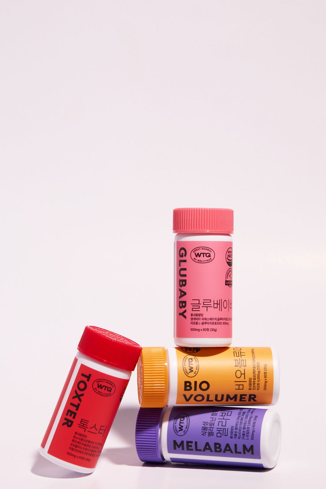 SH FOOD · 건강기능식품 — TOXTER·GLUBABY·BIO VOLUMER·MELABALM 4종 전 제품을 함께 쌓은 라인업컷, 뉴트럴 배경